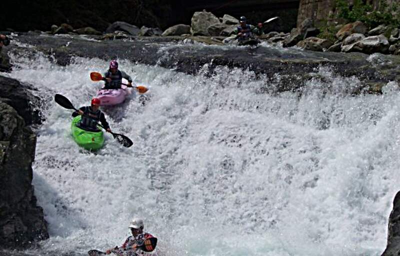 Kayaking down rapids