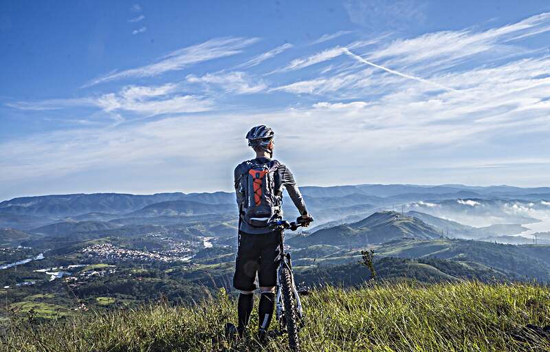 Cyclist on a hilltop