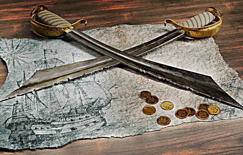 Crossed sabres on treasure map